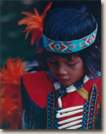 boy in Native American regalia